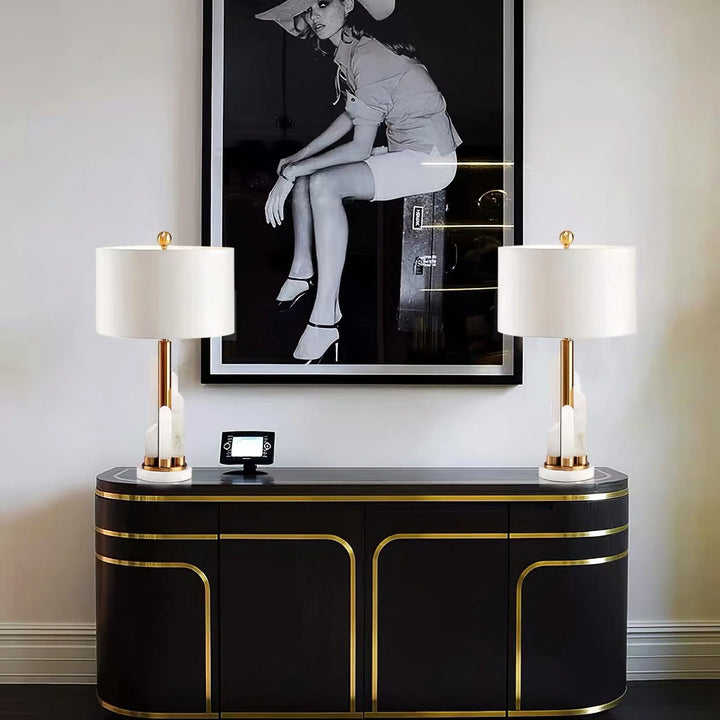 Front view of modern Orbit metal table lamp with metallic finish and ambient lighting