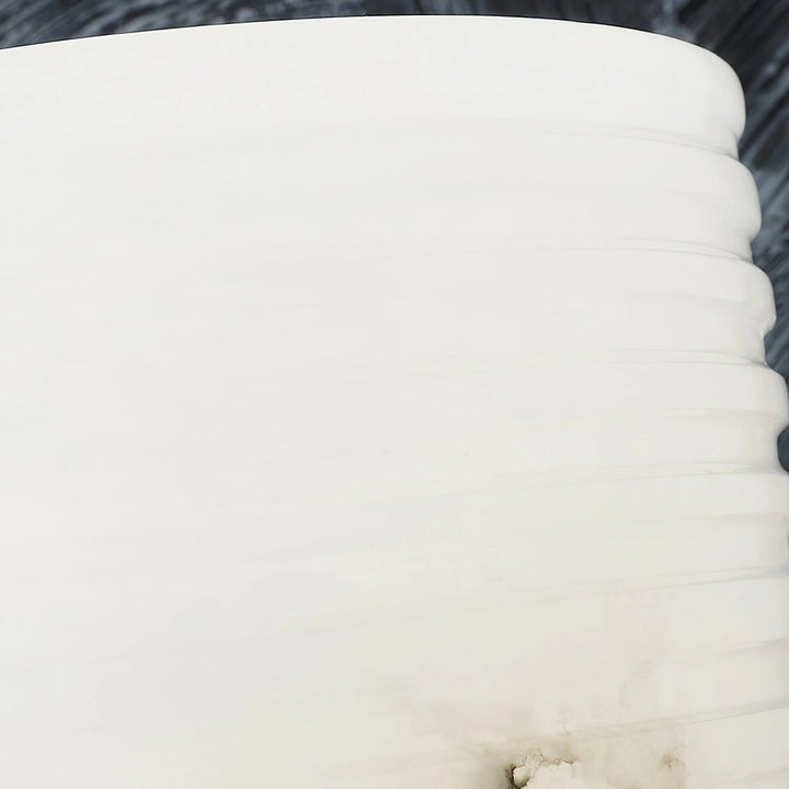Close-up detail of Outela table lamp marble, highlighting luxurious texture and modern elegant design