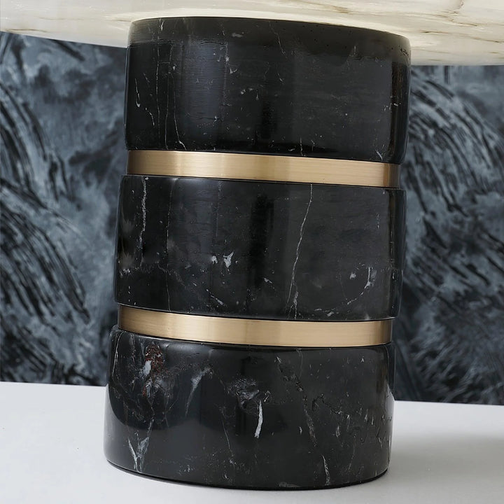 Detail view of Outela table lamp, showcasing modern design with marble accents and warm ambient lighting