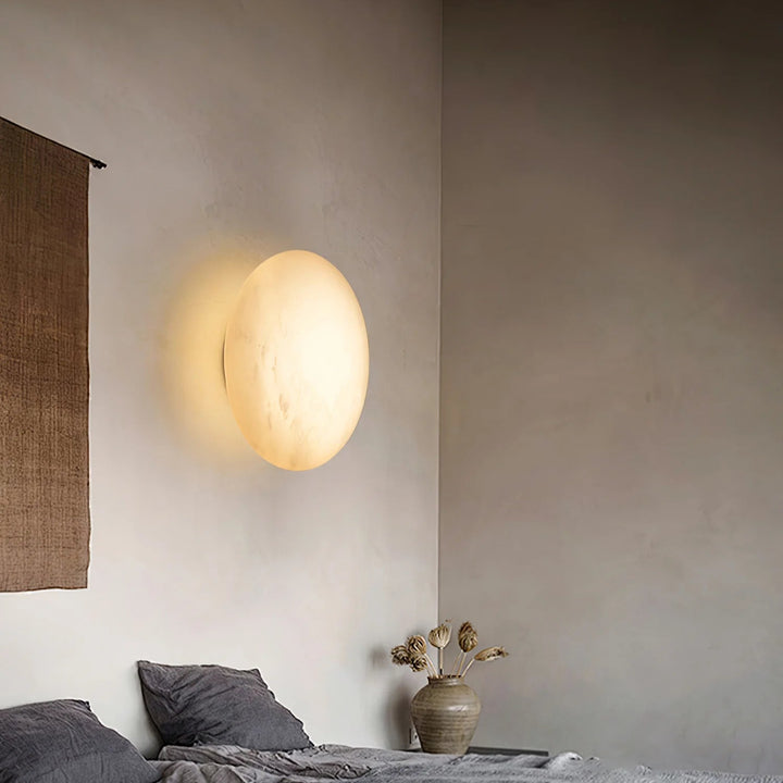 Pebble alabaster wall light bedside view, elegant marble finish for modern bedroom interior lighting