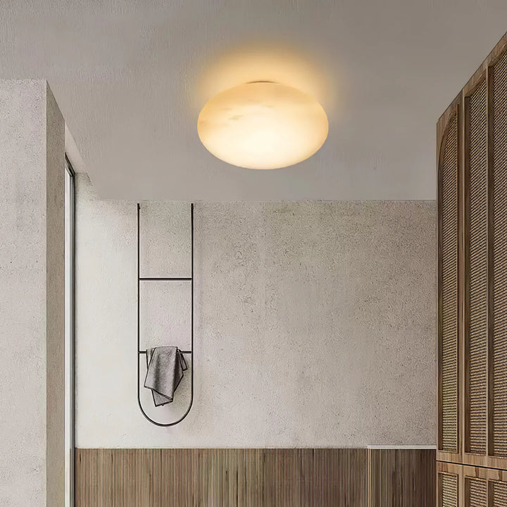 Pebble alabaster wall light ceiling view in room, elegant marble design for modern interior lighting