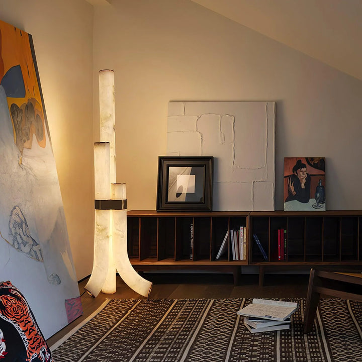 Sleek piped alabaster floor lamp with modern brass design, offering warm ambient lighting for homes