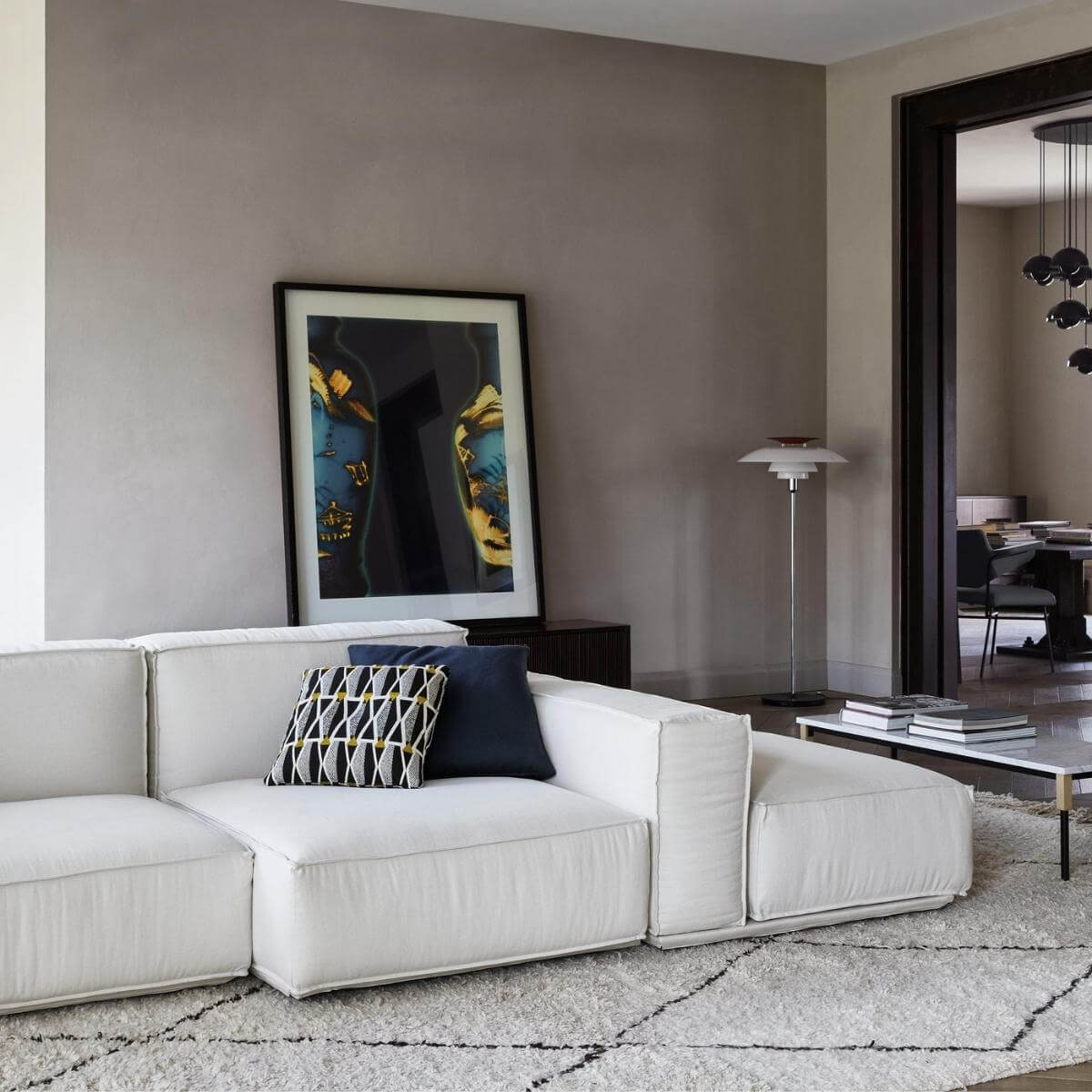 Right side view of PlushParadise white cotton linen sofa with modern design and plush cushions