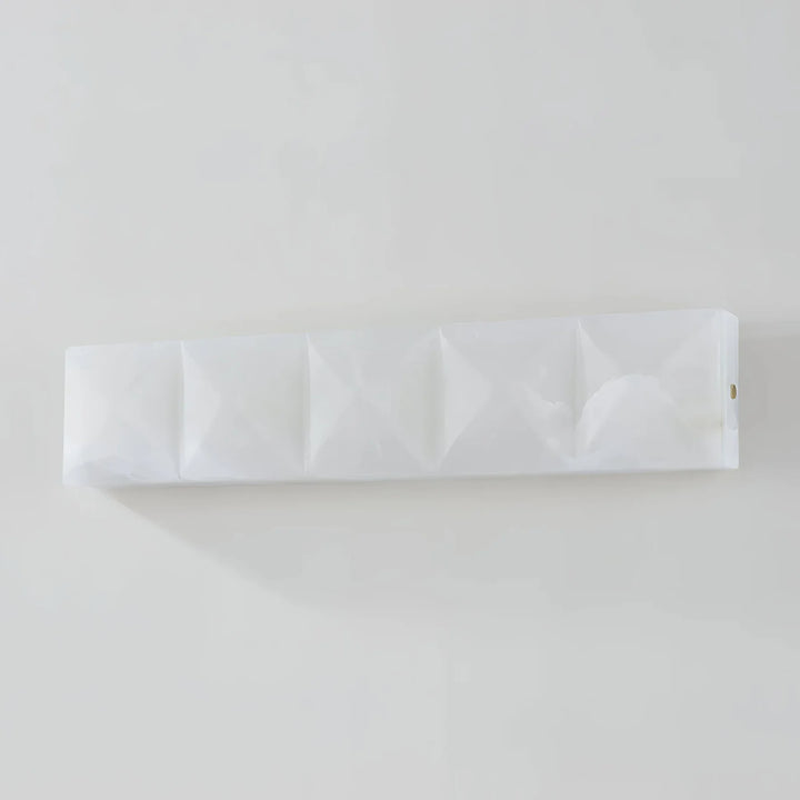 Prism alabaster wall sconce with four marble pieces front view, elegant modern wall lighting