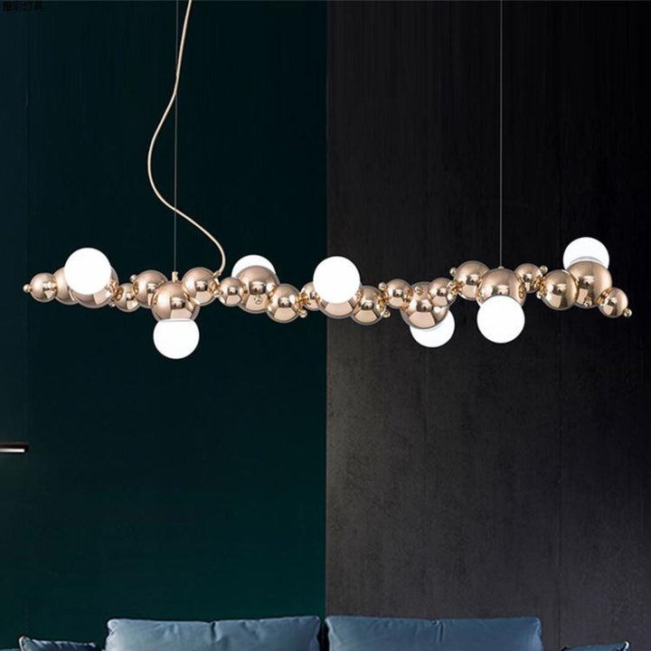 Close-up of Radiance kitchen island chandelier showcasing modern metal frame, elegant light bulbs, and contemporary design details