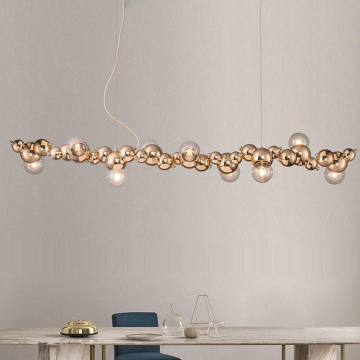 Radiance kitchen island chandelier light fixture elegantly hanging above a dining table, offering modern ambient lighting for dining spaces