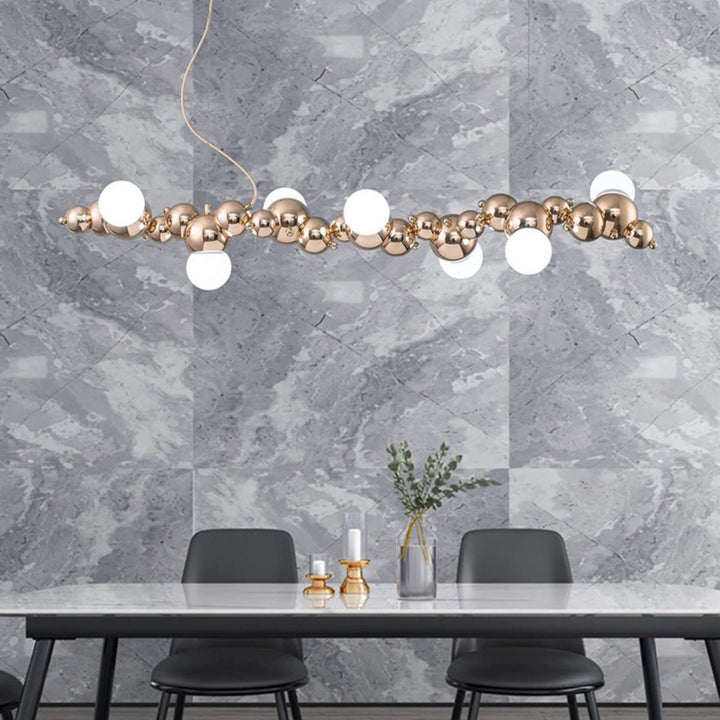 Radiance kitchen island chandelier light fixture elegantly hanging above a dining table, offering modern ambient lighting for dining spaces