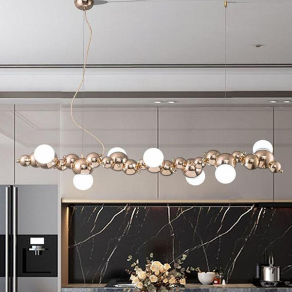 Radiance chandelier light fixture installed above kitchen island, providing elegant and functional lighting for dining and cooking areas