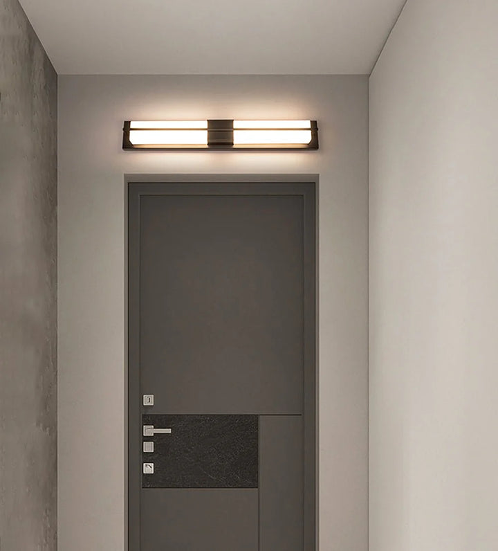 Rectangular alabaster brass wall sconce luxury lighting turned on above home gate elegant decor