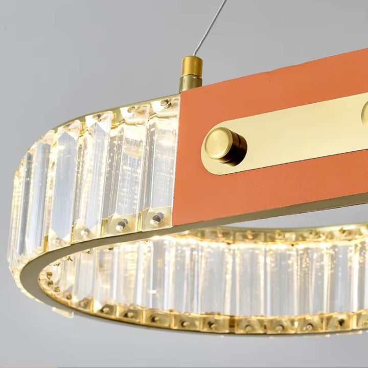 Rectangular crystal chandelier hanging above kitchen island, featuring elegant design and sparkling crystal