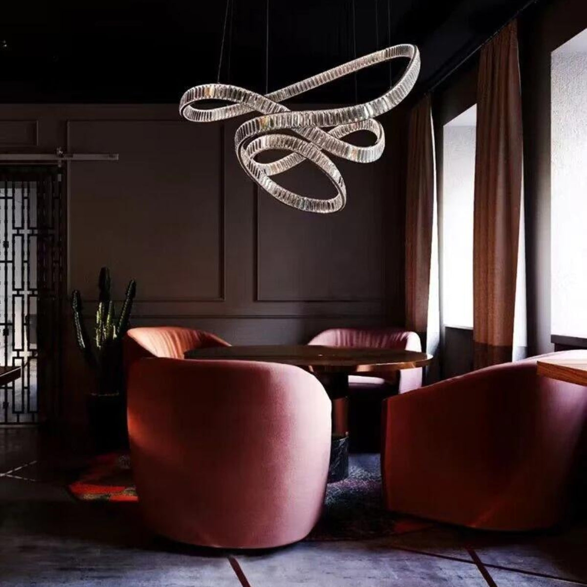 Reflected chandelier light above dining table in Australia, enhancing the space with shimmering elegance and modern charm