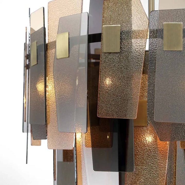 Detailed close-up of Renato 11-bulb rectangular chandelier with amber smoky glass – showcasing textured glass and elegant metal frame craftsmanship.