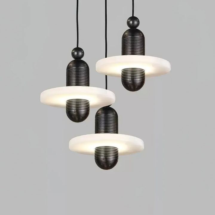 Saturn pendant light with single marble on black metal, front view