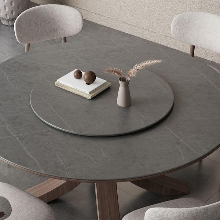 Upper close-up view of Scandinavian round dining table with ash wood base highlighting smooth tabletop and wood grain texture