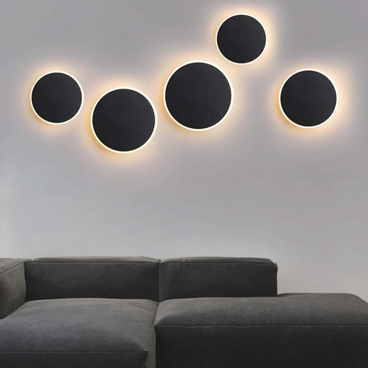 SleekSphere round LED touch wall lamp installed in living room – modern ambient lighting with minimalist circular design.