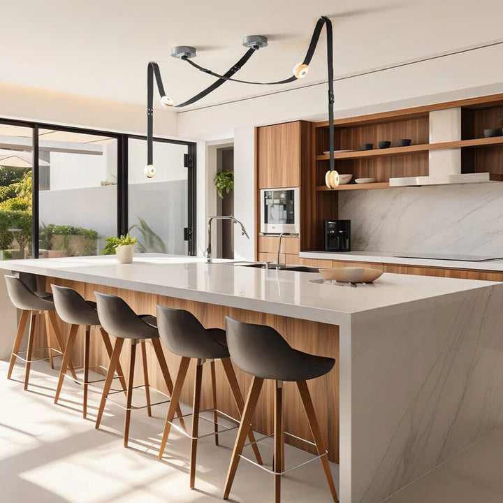 Snaps alabaster pendant light in kitchen room view with gold metal accents, modern elegant lighting design"