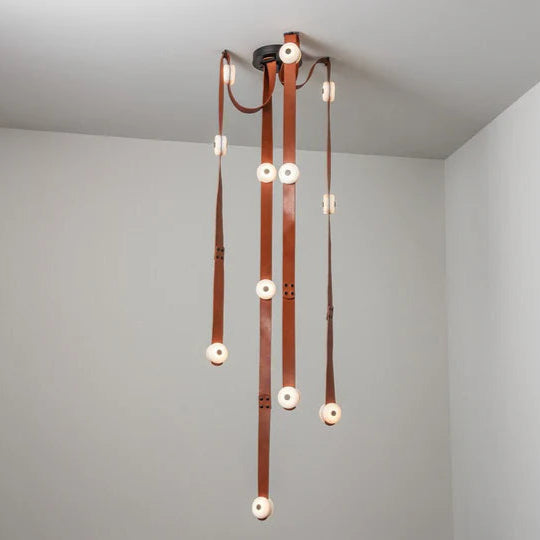 Snaps alabaster pendant light hanging view with gold metal accents and alabaster shades, modern elegant design
