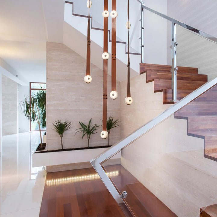 Snaps alabaster pendant light side view at staircase, elegant marble design for modern home interiors