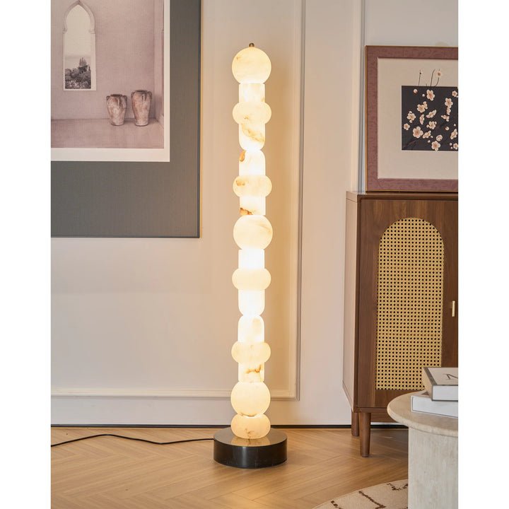 Modern Spanish alabaster floor lamp next to bed for stylish bedroom décor