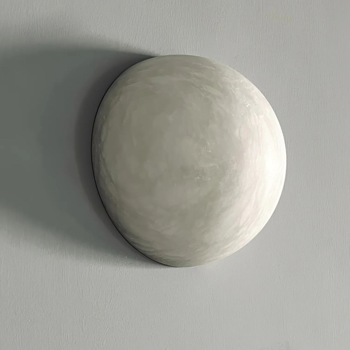 Side view of Spanish alabaster snowflake wall sconce, modern elegant wall-mounted lighting fixture