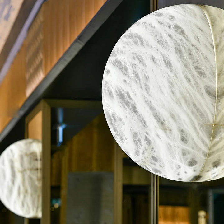 Close side view of Spanish alabaster snowflake wall sconce, elegant wall-mounted lighting fixture