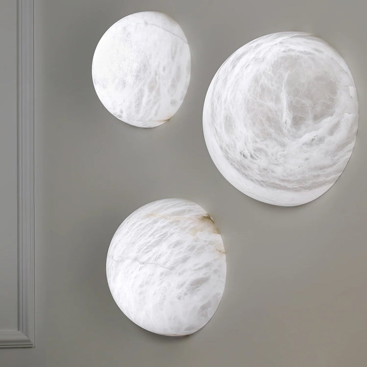 Spanish alabaster snowflake wall sconce displaying three sizes for home lighting