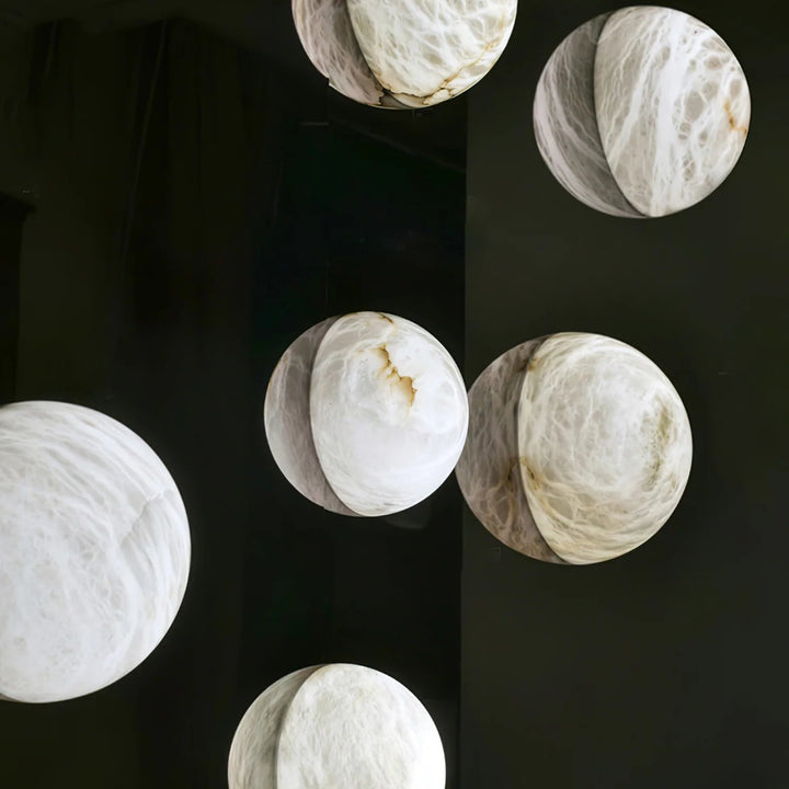 Front view of Spanish alabaster snowflake wall sconce for stylish home décor lighting