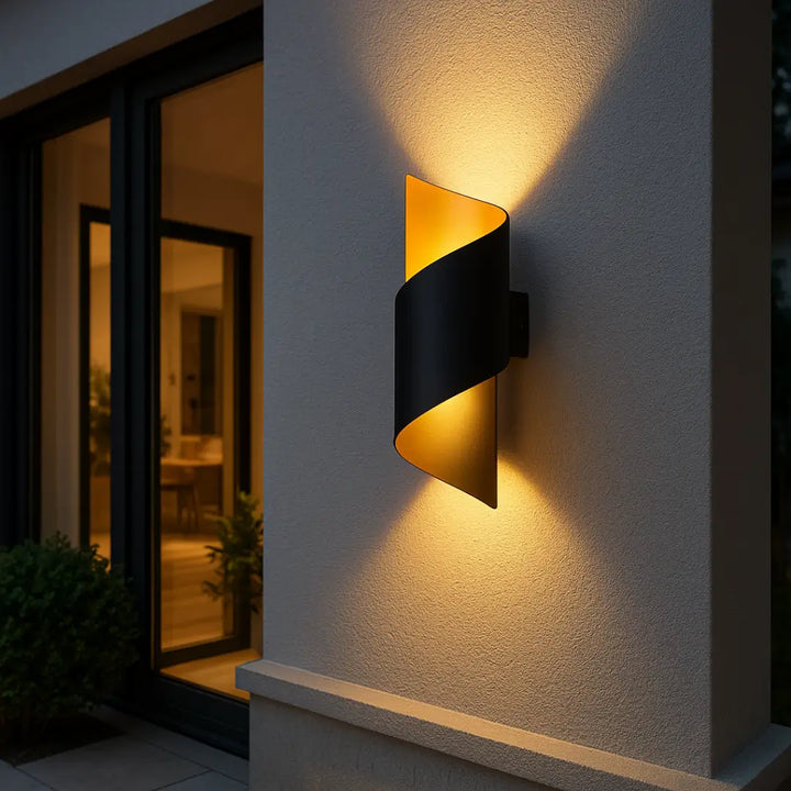 Spiral outdoor wall light in black and gold, IP65 rated, stylish and weatherproof for exterior use.
