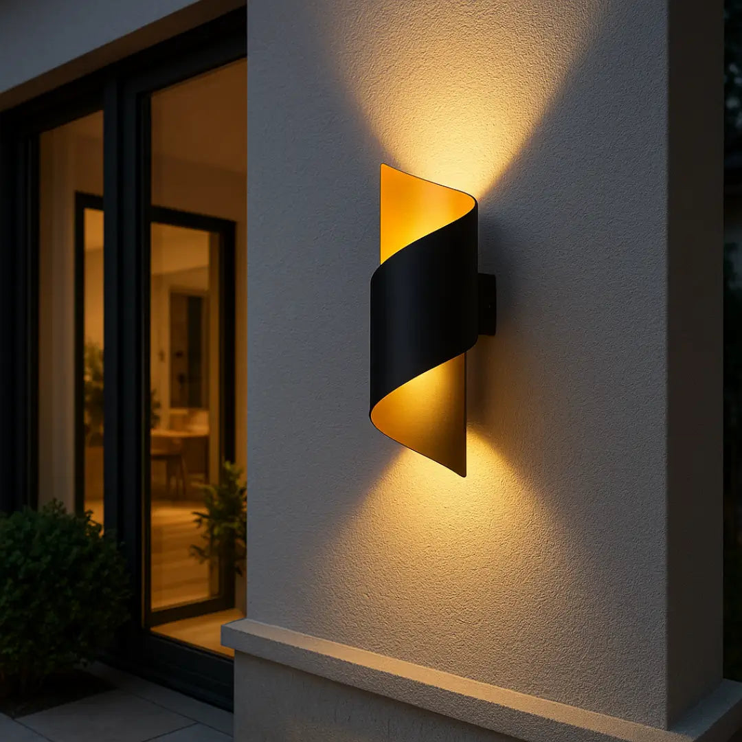 Spiral outdoor wall light in black and gold, IP65 rated, stylish and weatherproof for exterior use.