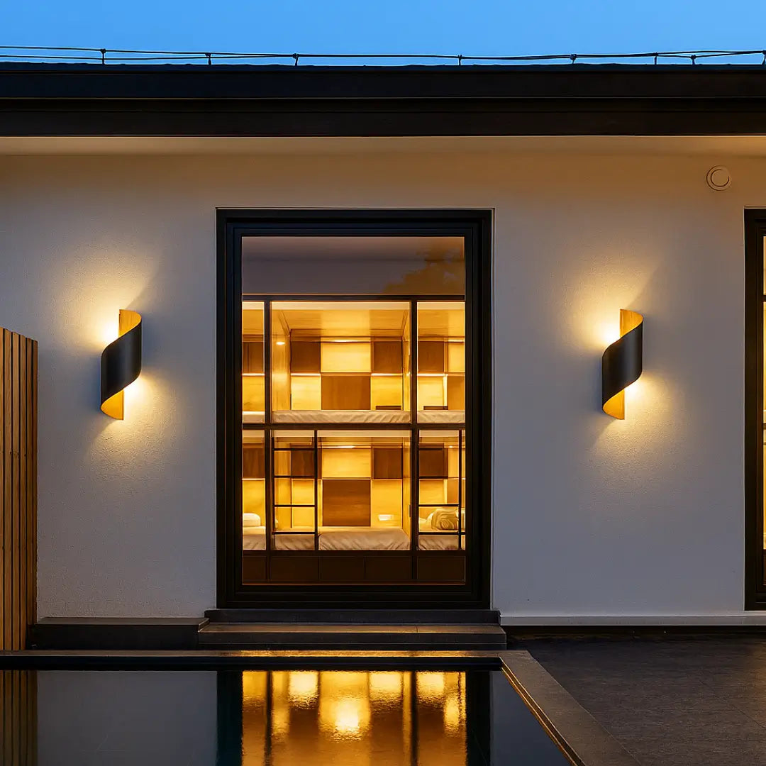 Spiral outdoor wall light in black and gold, IP65 rated, perfect for durable and stylish outdoor lighting.