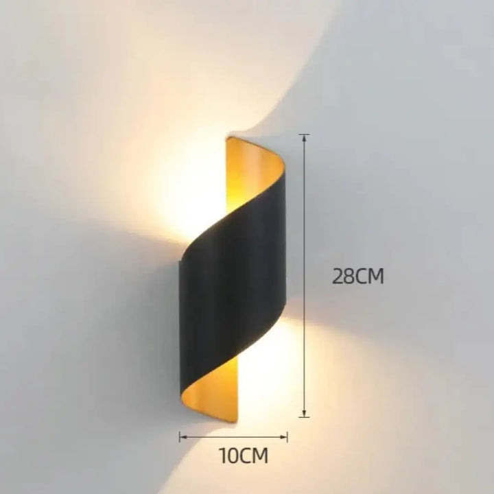 Spiral outdoor wall light in black and gold, IP65 rating, durable and stylish for outdoor spaces.