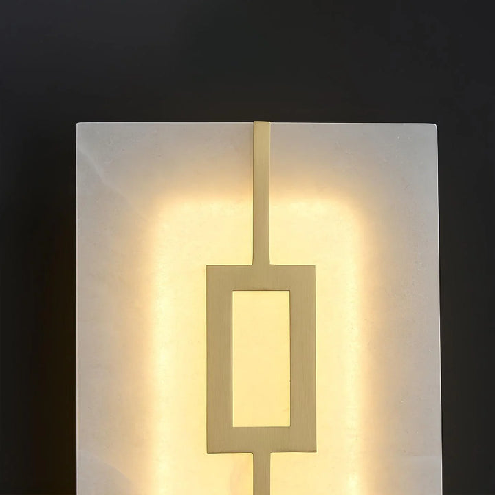 Close-up detail of square alabaster wall lamp, highlighting luxury design and warm ambient lighting