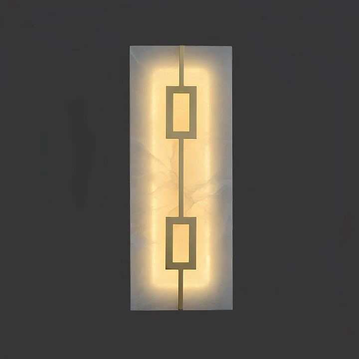 Front view of square alabaster wall lamp turned on, showcasing warm glow and luxury design