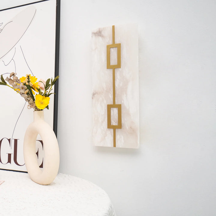 Side wall view of square alabaster wall lamp, showcasing luxury design and warm ambient lighting