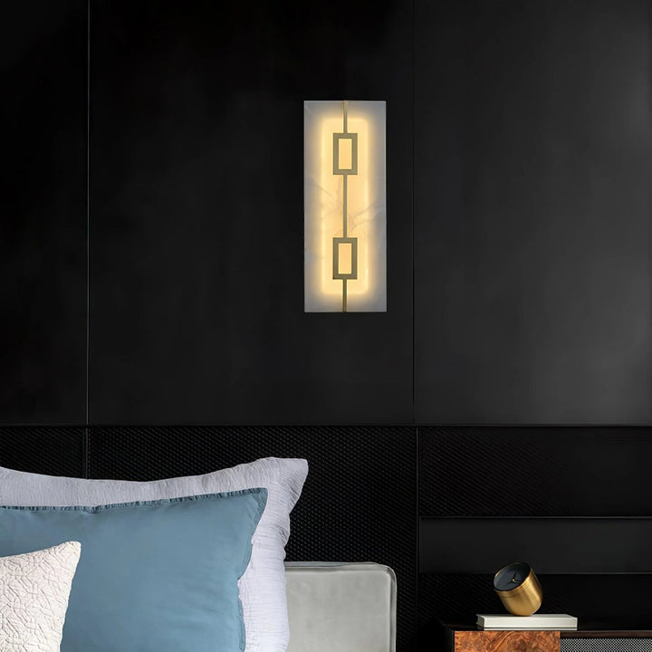 Front view of square alabaster wall lamp, featuring luxury design with warm ambient lighting for interiors