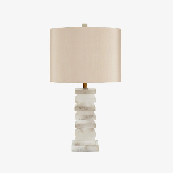 Front view of stacked alabaster table lamp with natural stone base and linen shade, modern lighting