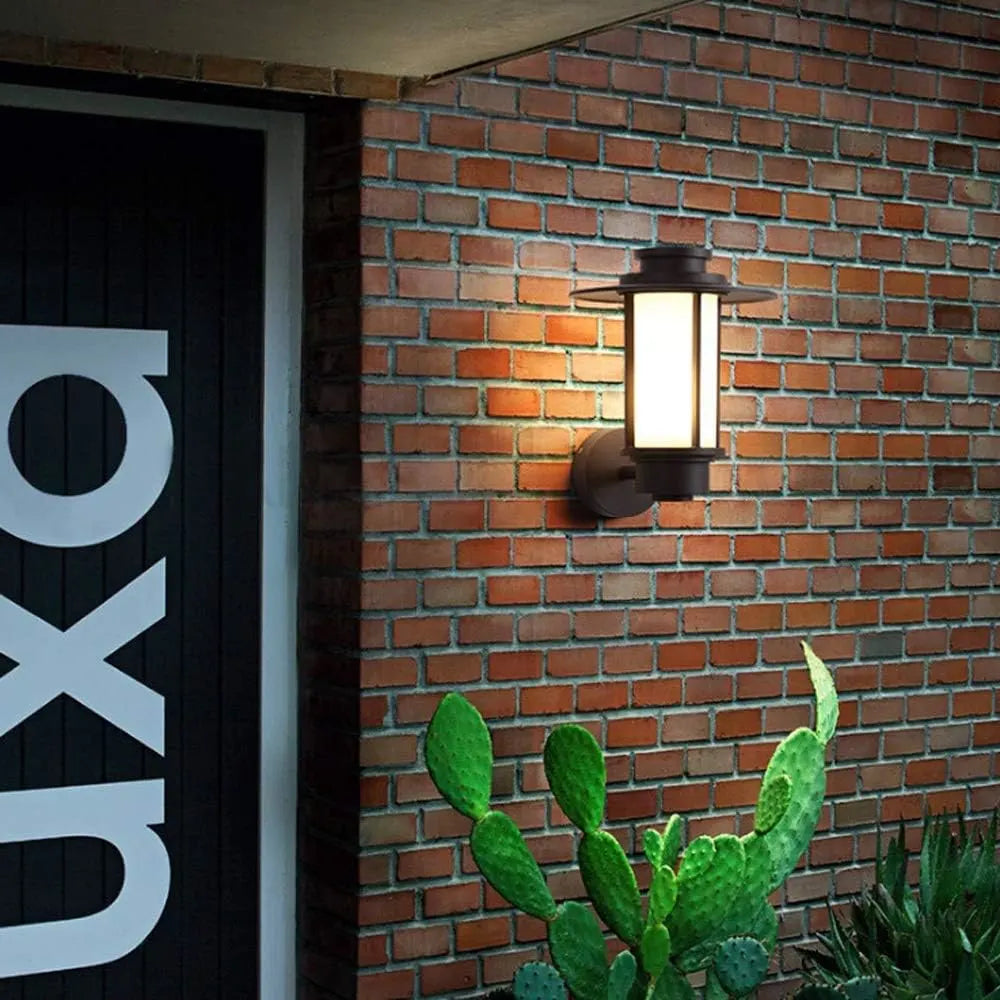 Front view of STEEL HALO Outdoor Wall Light – Bold sculptural design with durable materials, offering warm, inviting 3000K illumination for outdoor spaces.