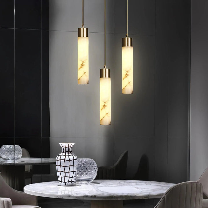 Tala brass pendant lamp above dining table modern elegant home lighting decor stylish fixture