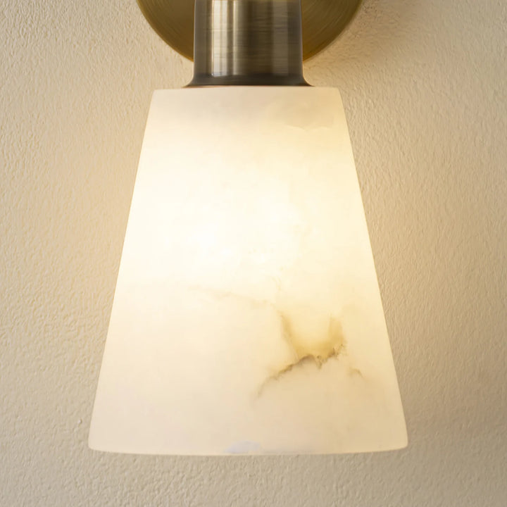 Tapered alabaster wall sconce modern lighting close-up view of marble detail