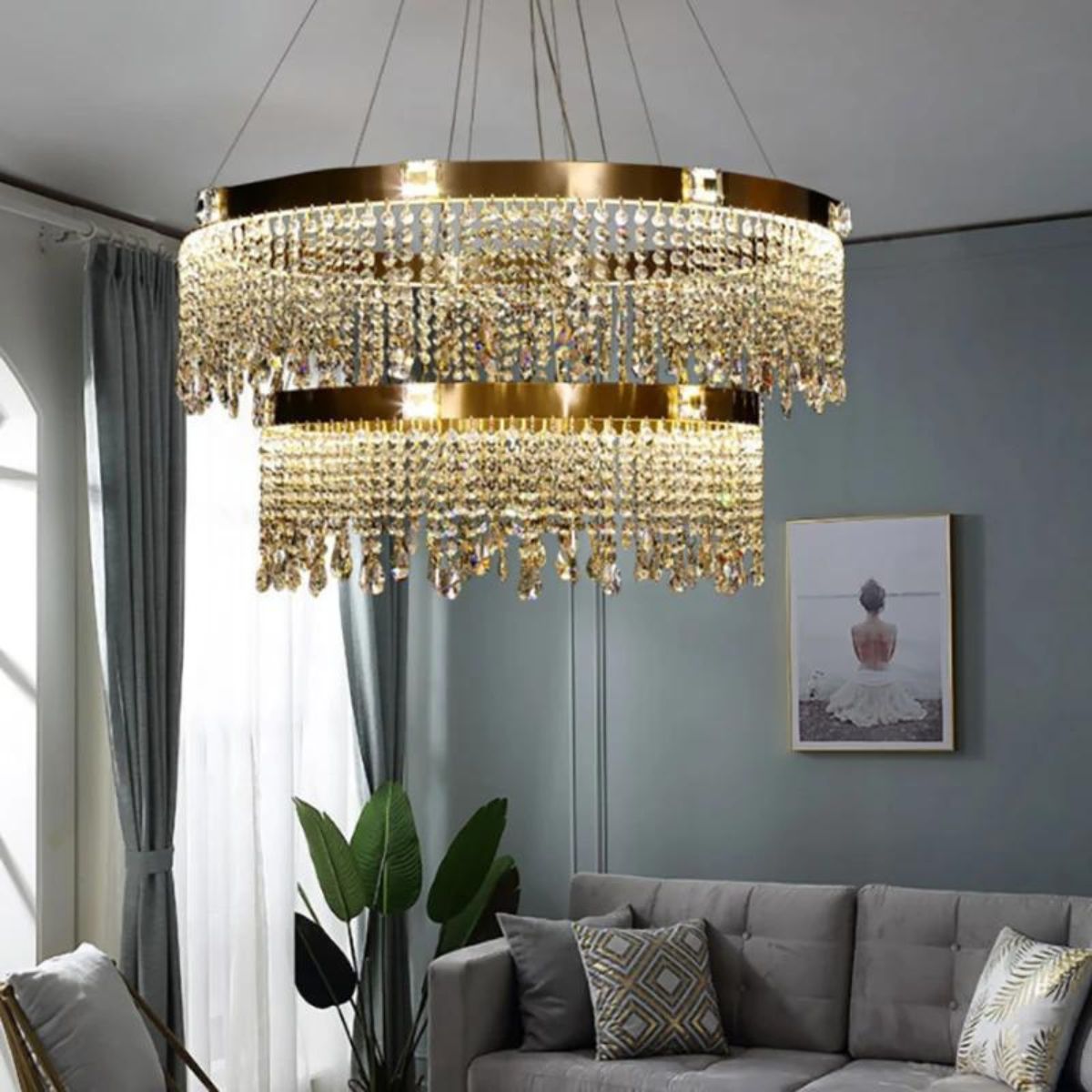 Tinsel chandelier light hanging in living room, adding festive sparkle and elegant ambiance to the space