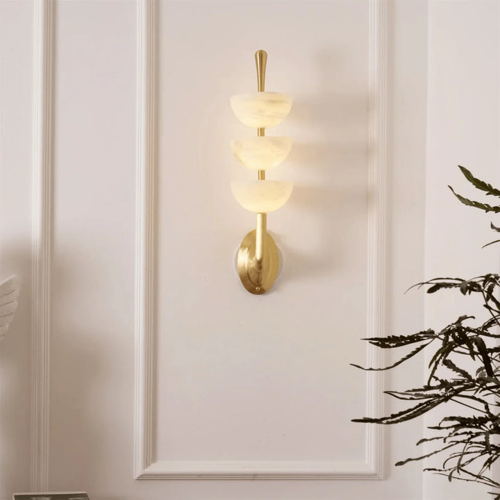 Triple Alabaster Wall Sconce on living room wall, luxury lighting, elegant home interior décor