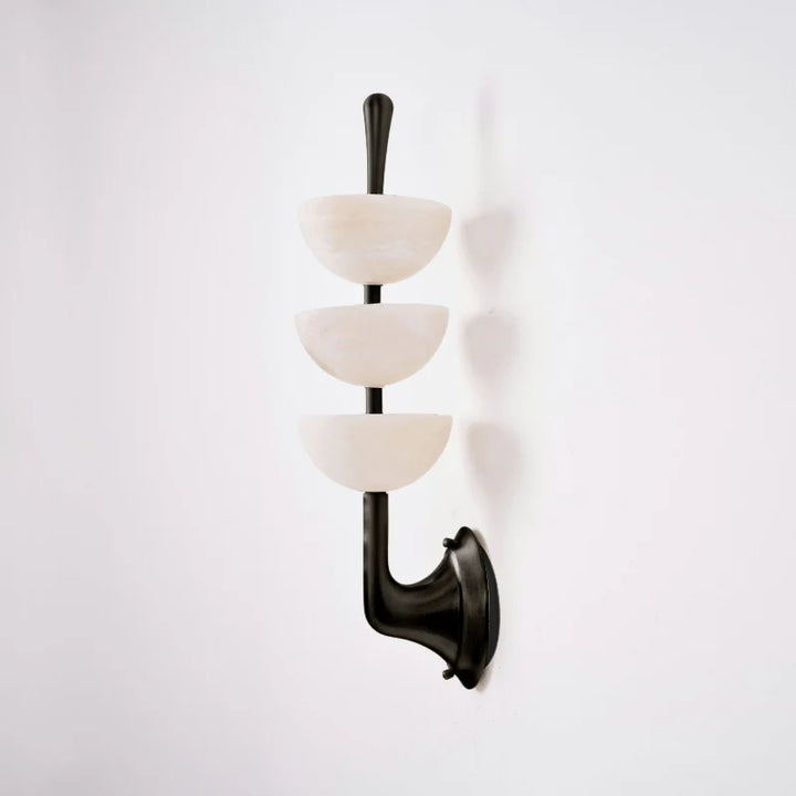 Side view of Triple Alabaster Wall Sconce with black metal, luxury lighting, elegant home décor