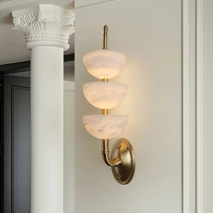 Side view of Triple Alabaster Wall Sconce with golden metal, luxury lighting, elegant home décor