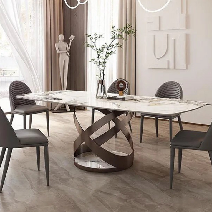 Marble dining table with elegant tripod base, combining luxurious stone top with modern minimalist support structure