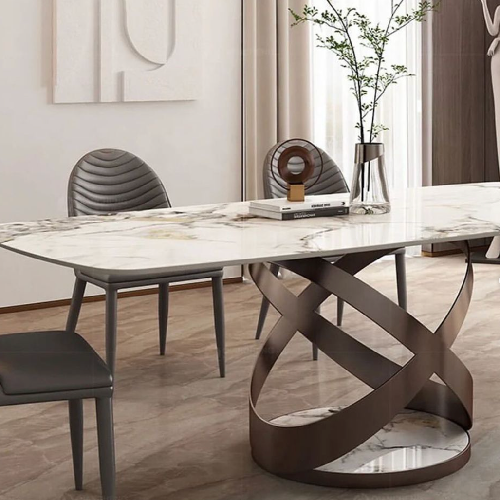 Marble dining table with elegant tripod base, combining luxurious stone top with modern minimalist support structure