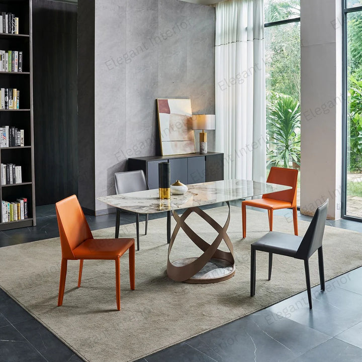 Tripod base marble dining table styled in a modern living room interior setting