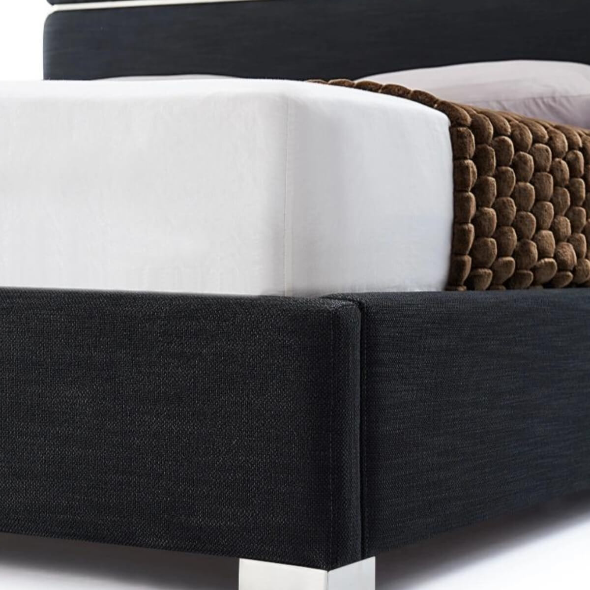 Close-up of Velvet Vista luxurious velvet bed corner showcasing plush fabric texture and sturdy frame