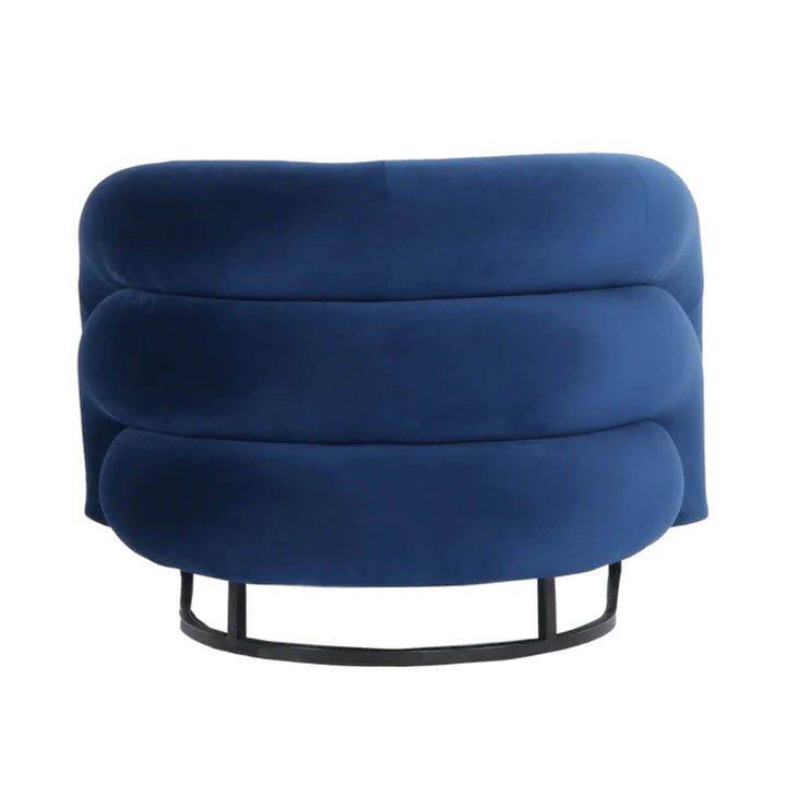 Back view of Velvet Vogue luxury velvet lounge chair showcasing smooth curves and soft fabric texture