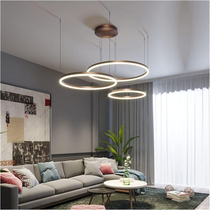 Vivid 3-ring circular chandelier light hanging in a modern living room, providing elegant ambient lighting and a stylish focal point