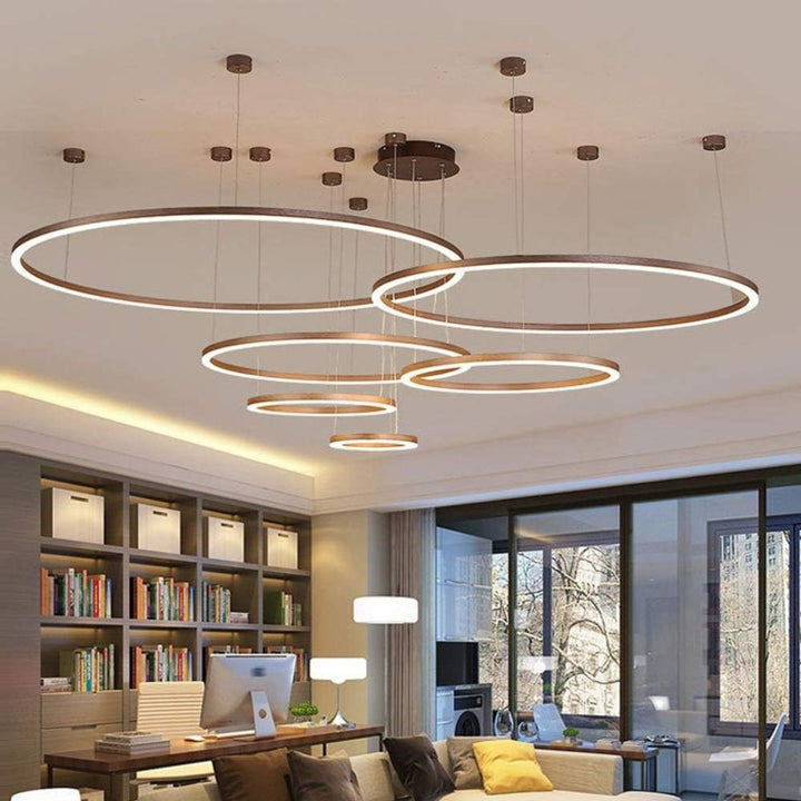 Vivid 5-ring circular chandelier light installed in a stylish living room, providing warm ambient lighting and a modern decorative centerpiece